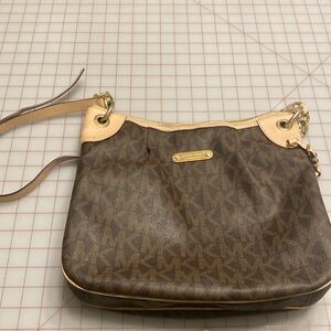 Well loved but in usable condition. Over the shoulder bag and around 9 in.